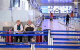 Passengers wait at the largely empty Ben Gurion airport on April 9, 2026. (Avshalom Sassoni/FLASH90)