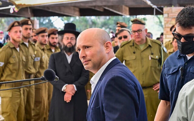 Former prime minister Naftali Bennett attends a funeral at the military cemetery in Beit She'an on April 9, 2026. (Michael Giladi/Flash90)
