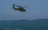 An Israeli Air Force helicopter flies near the border with Lebanon, on April 14, 2026. (Ayal Margolin/Flash90)