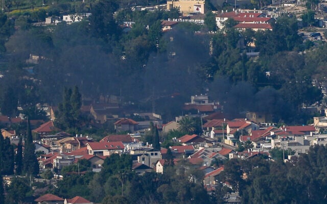 Smoke rises from the northern city of Kiryat Shmona after a rocket fired by Hezbollah from Lebanon struck the city, April 16, 2026. (Ayal Margolin/Flash90)