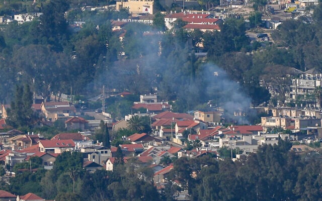 Smoke rises from the northern city of Kiryat Shmona after a rocket fired by Hezbollah from Lebanon struck the city, April 16, 2026. (Ayal Margolin/Flash90)
