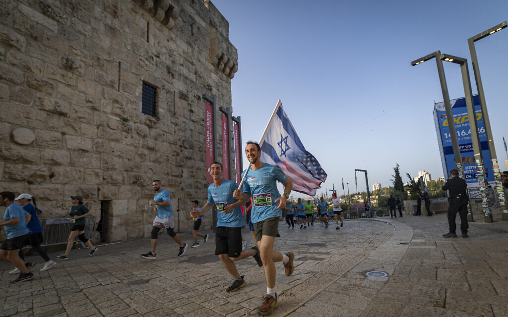 People run in the annual Jerusalem Marathon near the Old City walls in Jerusalem, April 17, 2026. (Yonatan Sindel/Flash90) People run in the annual Jerusalem Marathon near the Old City walls in Jerusalem, April 17, 2026. (Yonatan Sindel/Flash90)