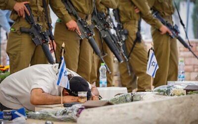 People visit at Ness Ziona Military Cemetery in Jerusalem on Memorial Day, April 21, 2026. (Tal Gal/Flash90) People visit at Ness Ziona Military Cemetery in Jerusalem on Memorial Day, April 21, 2026. (Tal Gal/Flash90)