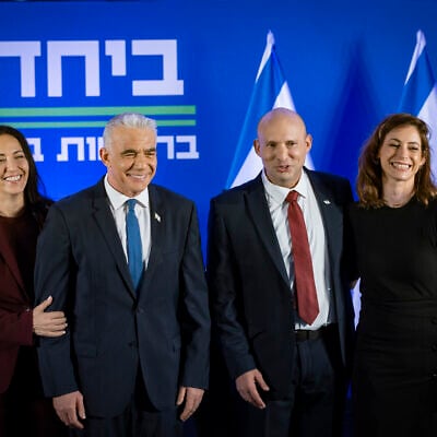 Yair Lapid (2nd left) and his wife Lihi, and Naftali Bennett and his wife Gilat at a press conference announcing the joint slate, “Together” ahead of upcoming elections, in Herzliya, central Israel, April 26, 2026. (Chaim Goldberg/Flash90