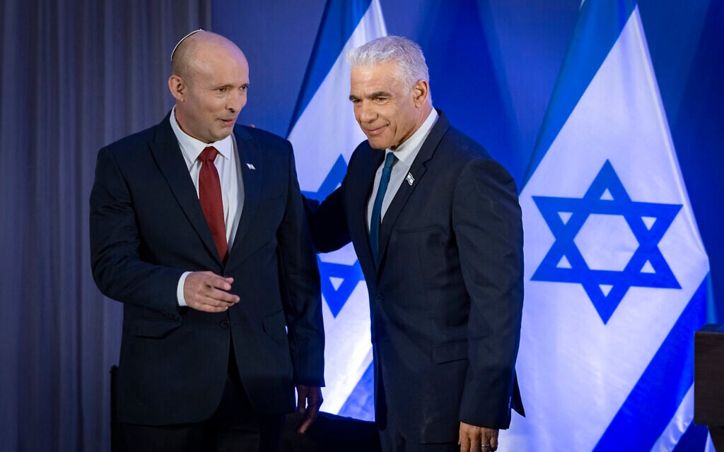 Former prime minister Naftali Bennett (left) and Opposition Leader Yair Lapid speak during a press conference announcing their joint slate named 'Together' ahead of upcoming elections, in Herzliya, April 26, 2026. (Chaim Goldberg/ Flash90) Former prime minister Naftali Bennett (left) and Opposition Leader Yair Lapid speak during a press conference announcing their joint slate named 'Together' ahead of upcoming elections, in Herzliya, April 26, 2026. (Chaim Goldberg/ Flash90)