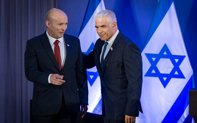 Former prime minister Naftali Bennett (left) and Opposition Leader Yair Lapid speak during a press conference announcing their joint slate named 'Together' ahead of upcoming elections, in Herzliya, April 26, 2026. (Chaim Goldberg/ Flash90) Former prime minister Naftali Bennett (left) and Opposition Leader Yair Lapid speak during a press conference announcing their joint slate named 'Together' ahead of upcoming elections, in Herzliya, April 26, 2026. (Chaim Goldberg/ Flash90)