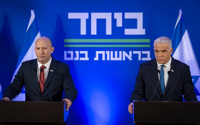 Opposition Leader Yair Lapid (right) and former prime minister Naftali Bennett speak during a press conference announcing their joint run in the coming elections, in Herzliya, central Israel, April 26, 2026. (Chaim Goldberg/Flash90)