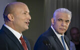 Opposition Leader Yair Lapid (right) and former prime minister Naftali Bennett at a press conference announcing their joint run in the coming elections, in Herzliya, central Israel, April 26, 2026. (Chaim Goldberg/Flash90)