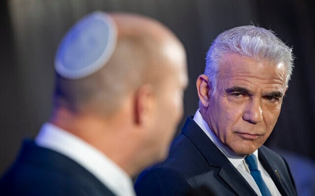 Opposition Leader Yair Lapid (right) and former prime minister Naftali Bennett at a press conference announcing their joint run in the coming elections, in Herzliya, central Israel, April 26, 2026. (Chaim Goldberg/Flash90) Opposition Leader Yair Lapid (right) and former prime minister Naftali Bennett at a press conference announcing their joint run in the coming elections, in Herzliya, central Israel, April 26, 2026. (Chaim Goldberg/Flash90)
