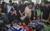 Family and friends of IDF soldier Sgt. Idan Fooks attend his funeral at the military cemetery in Petah Tikva, on April 27, 2026. (Tal Gal/Flash90)