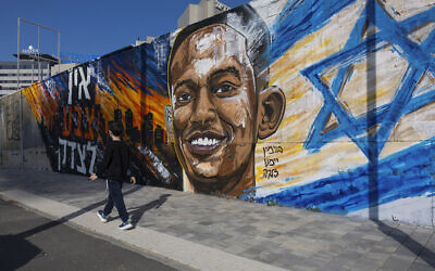 A child walks in front of a memorial mural of Yemanu Zelka, who was stabbed to death in Petah Tikva on Independence Day a week earlier, Ashdod, April 28, 2026. (Liron Moldovan/Flash90) A child walks in front of a memorial mural of Yemanu Zelka, who was stabbed to death in Petah Tikva on Independence Day a week earlier, Ashdod, April 28, 2026. (Liron Moldovan/Flash90)