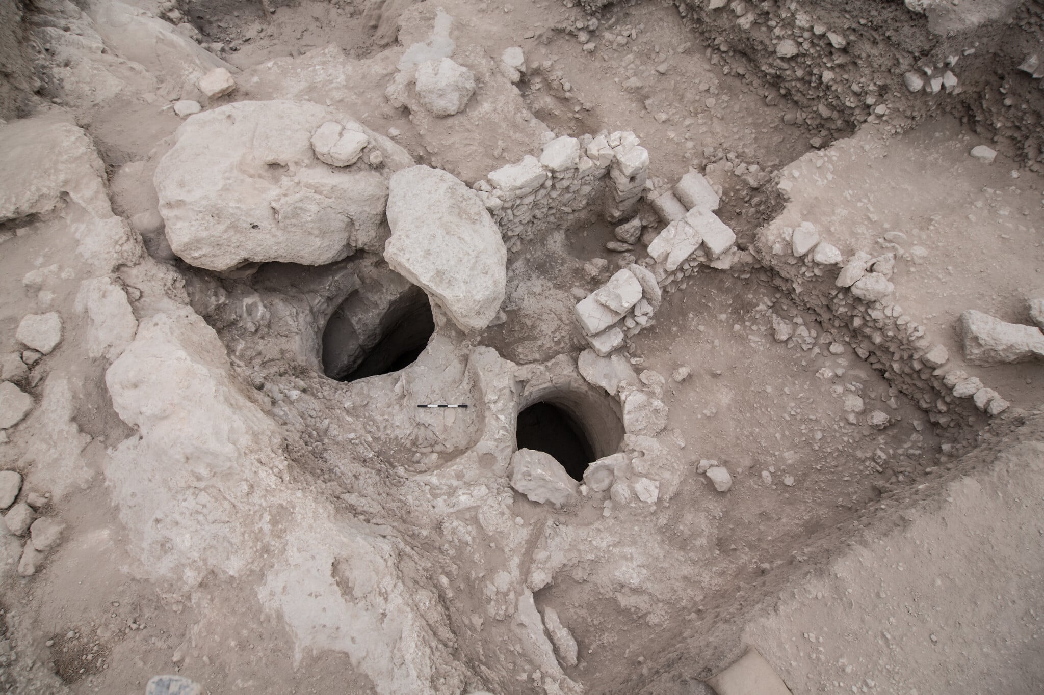 Archaeological photograph showing the opening shafts and staircase of the ancient cistern at Tel Azekah where the mass infant burial was discovered