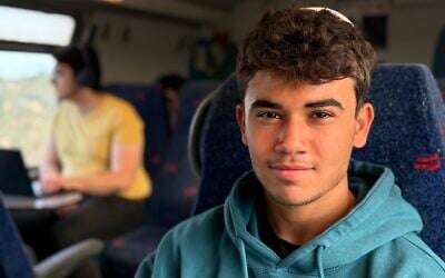 Uriah Dar, on his way home to Petah Tikva after a solo hike in northern Israel, April 15, 2026. (Sue Surkes/Times of Israel)