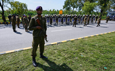 A police officer standing guard ahead of possible negotiations between the United States and Iran, Islamabad, Pakistan, April 10, 2026. (Anjum Naveed/AP)