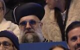 Eyal Tzionov, a TikTok personality who dresses up as the Sephardic chief rabbi, sits in the audience of Israel's annual Independence Day torch-lighting on Mount Herzl, Jerusalem, on April 21, 2026. (Screenshot/YouTube)