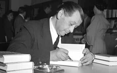 Friedrich Torberg signs a book on April 19, 1951, in Vienna. (Public domain)