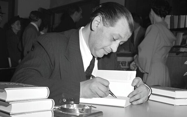 Friedrich Torberg signs a book on April 19, 1951, in Vienna. (Public domain)