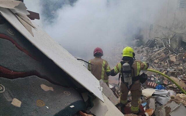 Firefighters operate at the scene of a direct missile strike on a residential building in Haifa, on April 5, 2026. (Haifa Fire and Rescue Service)