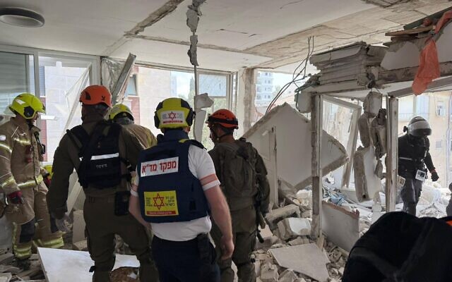 First responders at the site of an Iranian cluster submunition impact in Ramat Gan, April 6, 2026. (Magen David Adom)