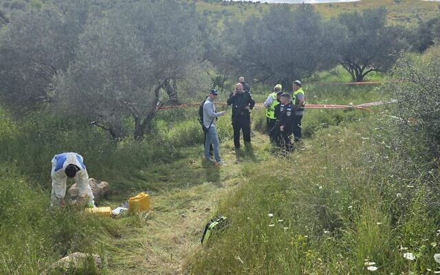 Police search for evidence in a grove near Avnei Hefetz, a settlement in the northern West Bank, after a dead body was discovered in the area on April 8, 2026. (Israel Police) Police search for evidence in a grove near Avnei Hefetz, a settlement in the northern West Bank, after a dead body was discovered in the area on April 8, 2026. (Israel Police)