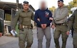 Police arrest one of eight individuals suspected in the fatal shooting of Wael Saeida, in the Galilee town of Umm al-Ghanem on April 14, 2026. (Israel Police)