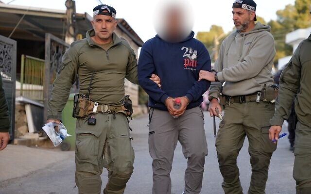Police arrest one of eight individuals suspected in the fatal shooting of Wael Saeida, in the Galilee town of Umm al-Ghanem on April 14, 2026. (Israel Police)