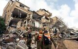 Home Front Command search and rescue forces work amid the rubble of a residential building struck by an Iranian missile in Haifa, April 6, 2026. (Israel Defense Forces)