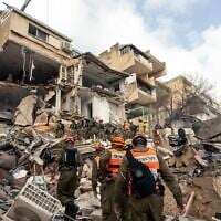 Home Front Command search and rescue forces work amid the rubble of a residential building struck by an Iranian missile in Haifa, April 6, 2026. (Israel Defense Forces)