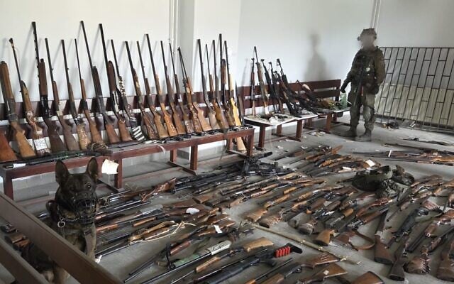 Weapons recovered by IDF troops in a school in the Bint Jbeil area of southern Lebanon, in a photo published April 16, 2026. (Israel Defense Forces)