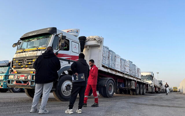 Trucks transporting humanitarian aid wait to enter through the Egyptian side of the Rafah border crossing with the Gaza Strip on March 19, 2026. (Amr Adel/AFP) Trucks transporting humanitarian aid wait to enter through the Egyptian side of the Rafah border crossing with the Gaza Strip on March 19, 2026. (Amr Adel/AFP)