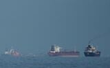 Oil tankers and cargo ships lining up in the Strait of Hormuz as seen from Khor Fakkan, United Arab Emirates, March 11, 2026. (AP Photo/Altaf Qadri)