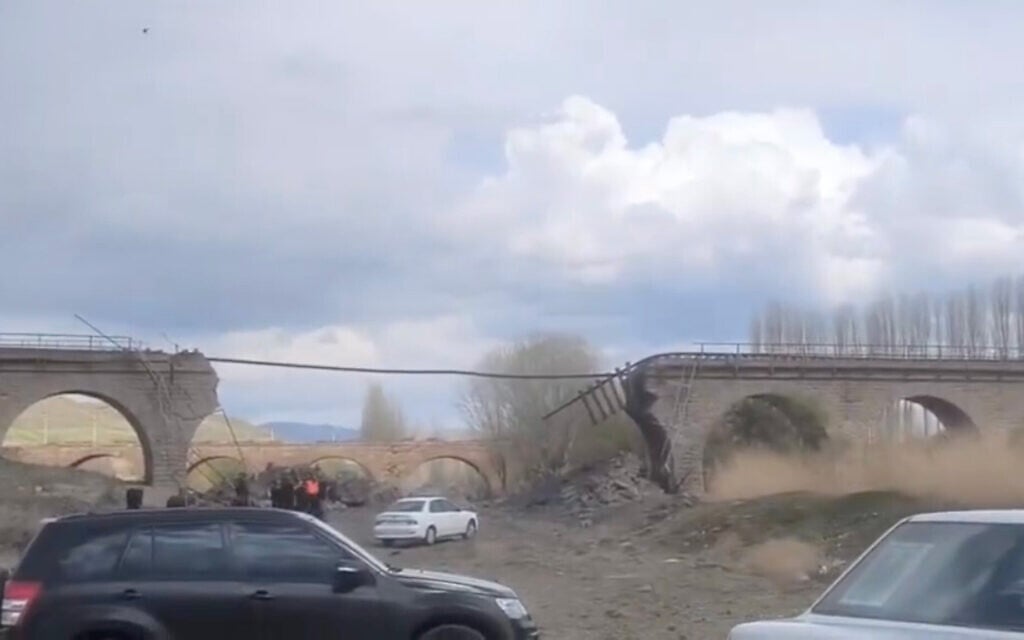 A railway bridge apparently hit in a strike near Amin Abad, Iran on April 7, 2026. (Screenshot from video posted on X)