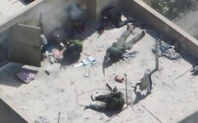 Six Hezbollah gunmen are seen on a rooftop in the southern Lebanon town of Bint Jbeil, April 24, 2026. (Israel Defense Forces) Six Hezbollah gunmen are seen on a rooftop in the southern Lebanon town of Bint Jbeil, April 24, 2026. (Israel Defense Forces)