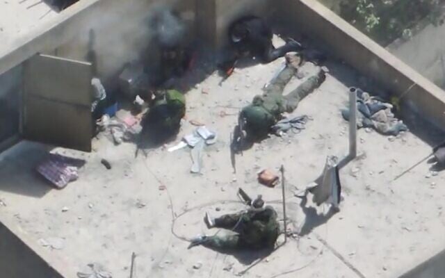 Six Hezbollah gunmen are seen on a rooftop in the southern Lebanon town of Bint Jbeil, April 24, 2026. (Israel Defense Forces) Six Hezbollah gunmen are seen on a rooftop in the southern Lebanon town of Bint Jbeil, April 24, 2026. (Israel Defense Forces)