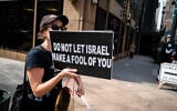 An anti-Israel protester in New York City, September 23, 2025. (Luke Tress/ Times of Israel)
