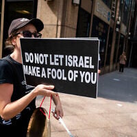An anti-Israel protester in New York City, September 23, 2025. (Luke Tress/ Times of Israel)