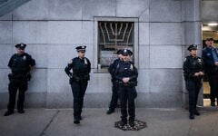 Police protect a Jewish center during an anti-Zionist rally, in Brooklyn, New York City, May 12, 2026. (Luke Tress/Times of Israel)
