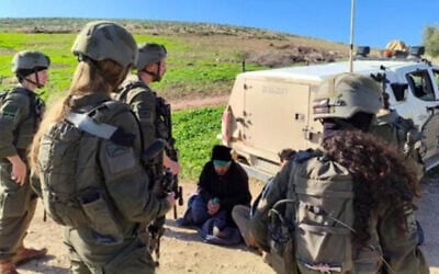 A Palestinian detained by soldiers in the Jordan Valley, 2026, seen in a photo included in a petition to the High Court. (Courtesy) A Palestinian detained by soldiers in the Jordan Valley, 2026, seen in a photo included in a petition to the High Court. (Courtesy)