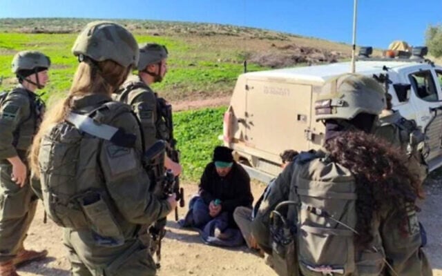 A Palestinian detained by soldiers in the Jordan Valley, 2026, seen in a photo included in a petition to the High Court. (Courtesy)