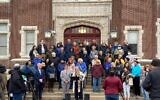 Opponents of Hebrew Union College's decision to stop ordaining rabbis at its Cincinnati campus rally in front of one of the school's buildings, April 7, 2022. (Courtesy of Lew Ebstein via JTA)