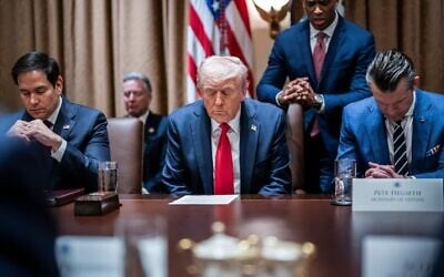 US President Donald Trump prays at the first cabinet meeting of his second term at the White House, in Washington, DC, in February 26, 2025. (Jabin Botsford/The Washington Post via Getty Images/JTA)