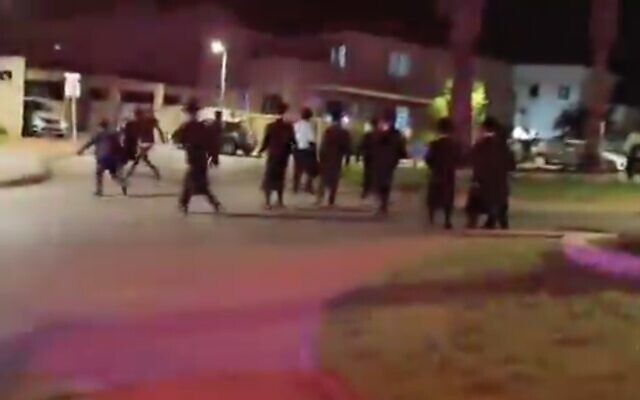 Haredi extremists demonstrate outside the home of the Military Police commander, Brig. Gen. Yuval Yamin, in Ashkelon on May 14, 2026. (X screenshot) Haredi extremists demonstrate outside the home of the Military Police commander, Brig. Gen. Yuval Yamin, in Ashkelon on May 14, 2026. (X screenshot)