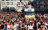 People take part in the annual Pride March in Rome, on June 10, 2023. (Photo by Vincenzo PINTO / AFP)