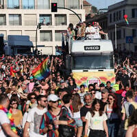 People take part in the annual Pride March in Rome, on June 10, 2023. (Photo by Vincenzo PINTO / AFP)