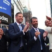 Eric Trump and Donald Trump Jr. pose outside Nasdaq in Times Square in New York on August 13, 2025 as World Liberty Financial and ALT5 Sigma ring the Nasdaq Stock Market opening bell. (TIMOTHY A. CLARY / AFP)