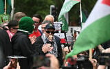Irish rap group Kneecap band member, Liam O'Hanna, who performs under the stage name Mo Chara, speaks to supporters outside Westminster Magistrates' Courts in London on August 20, 2025. (JUSTIN TALLIS / AFP)