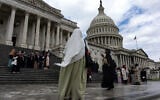 Members of the US Council of Muslim Organizations gather to pose for a group photo on the steps of the House of Representatives at the US Capitol as the group holds its 11th National Muslim Advocacy Day in Washington, DC, on April 20, 2026. (Kent Nishimura/AFP)
