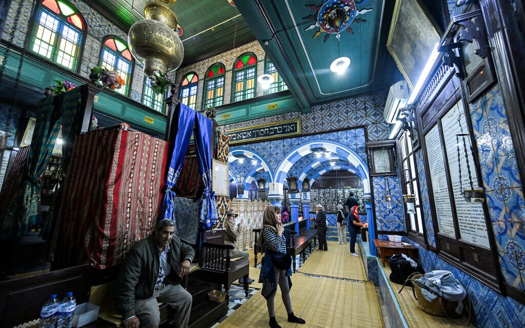 People visit the historic Ghriba synagogue on Tunisia's southern island of Djerba, a day before the pilgrimage to the Jewish holy site, on May 3, 2026. (FETHI BELAID / AFP)