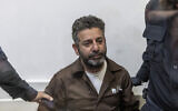 Israeli officers bring Spanish flotilla activist Saif Abu Keshek to a court in Ashkelon on May 5, 2026. (Ilia YEFIMOVICH / AFP)