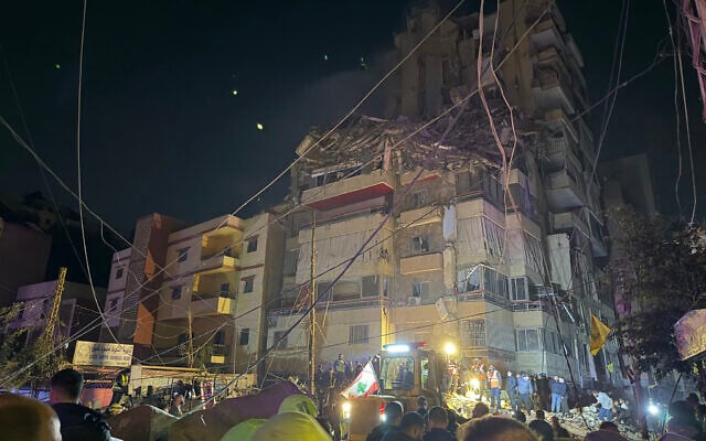 People gather at the site of an Israeli airstrike that targeted Beirut's southern suburbs Haret Hreik neighborhood on May 6, 2026. (Ibrahim AMRO / AFP)